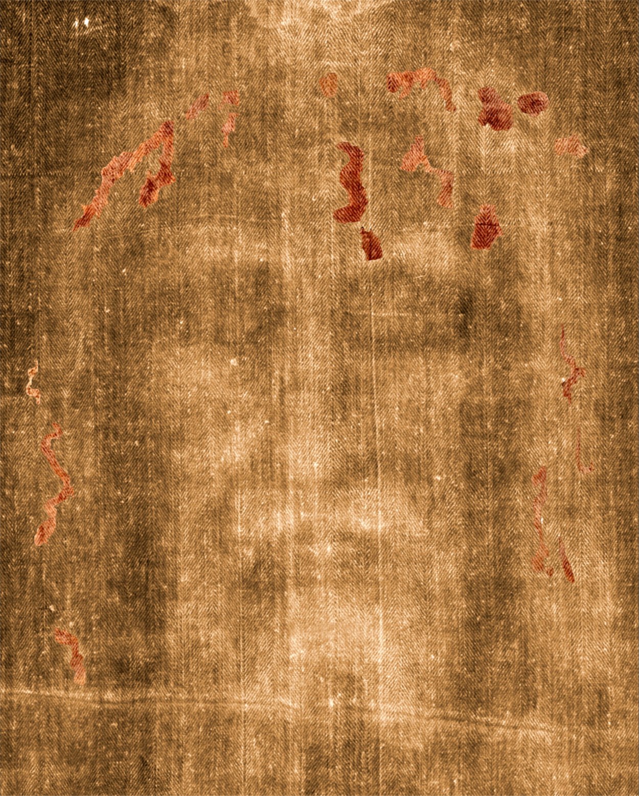 Enhanced photograph of the face of the Shroud with the blood-like areas highlighted in red